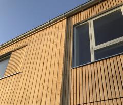 Dette billede illustrere Cembrit – Hårdfør facadeløsning til bæredygtig landsby